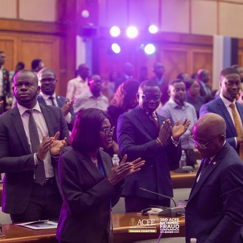 Delegates applauding in the conference hall in 2025