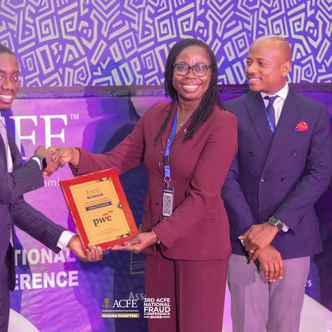 A partner receiving a plaque of appreciation on stage in 2025
